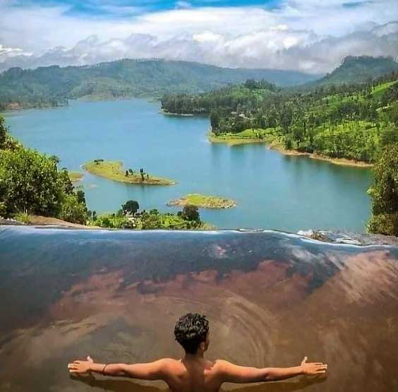 Scenic view of Gartmore Falls surrounded by lush greenery