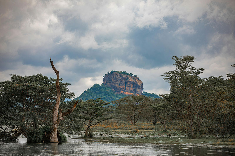 Tourists climbing Sigiriya Rock Fortress in Sri Lanka