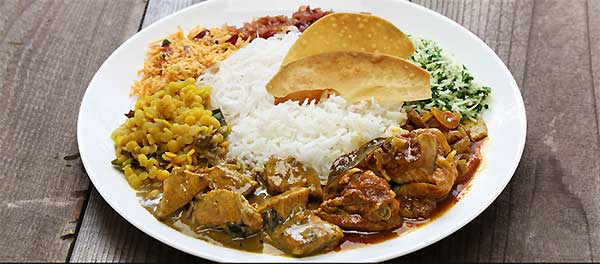 Traditional Sri Lankan rice and curry with multiple dishes