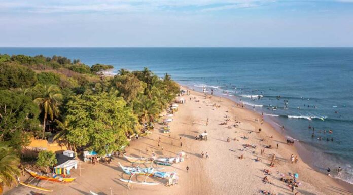 Arugam Bay Travel Guide, Sri Lanka: Surf, Slow Life & Raw Coastal Beauty Aerial view of Arugam Bay shoreline and turquoise waters